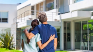 Happy couple looking at their new home